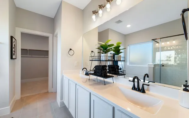a bathroom with a sink toilet and mirror