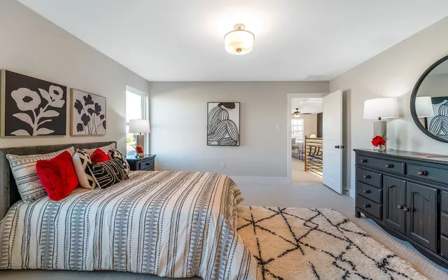 a bedroom with a large bed and a couch