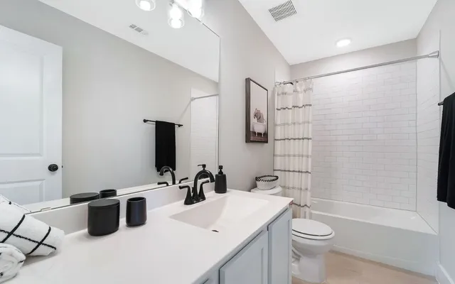 a bedroom with furniture and a window