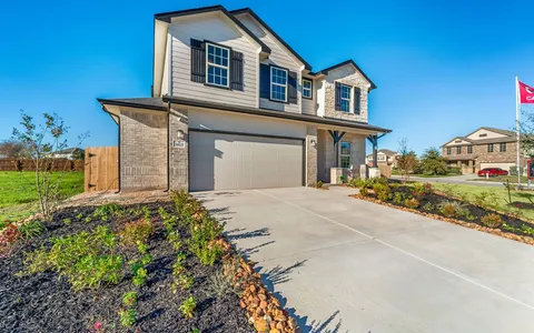 a kitchen with stainless steel appliances granite countertop a sink a stove and cabinets