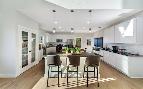 a view of a dining room with furniture