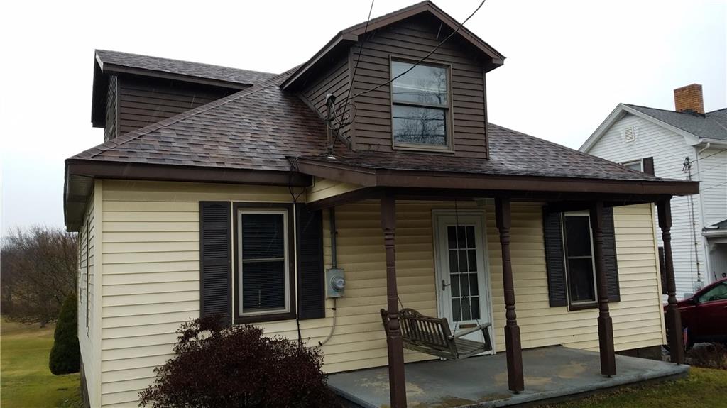 2391 Mt Pleasant Road Ruffs Dale, PA 15679 - Photo 2 of 19 Sit and relax on your front porch. Newer roof.