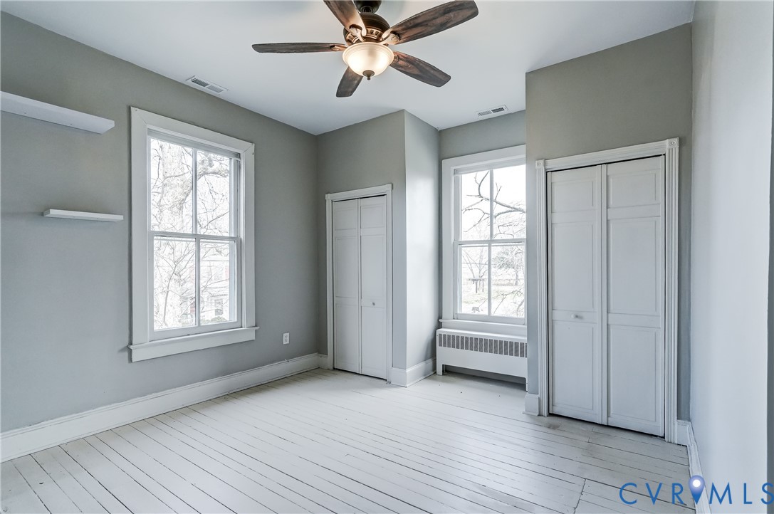 418 4th Street West Point, VA 23181 - Photo 20 of 36 a view of an empty room with a window and wooden floor