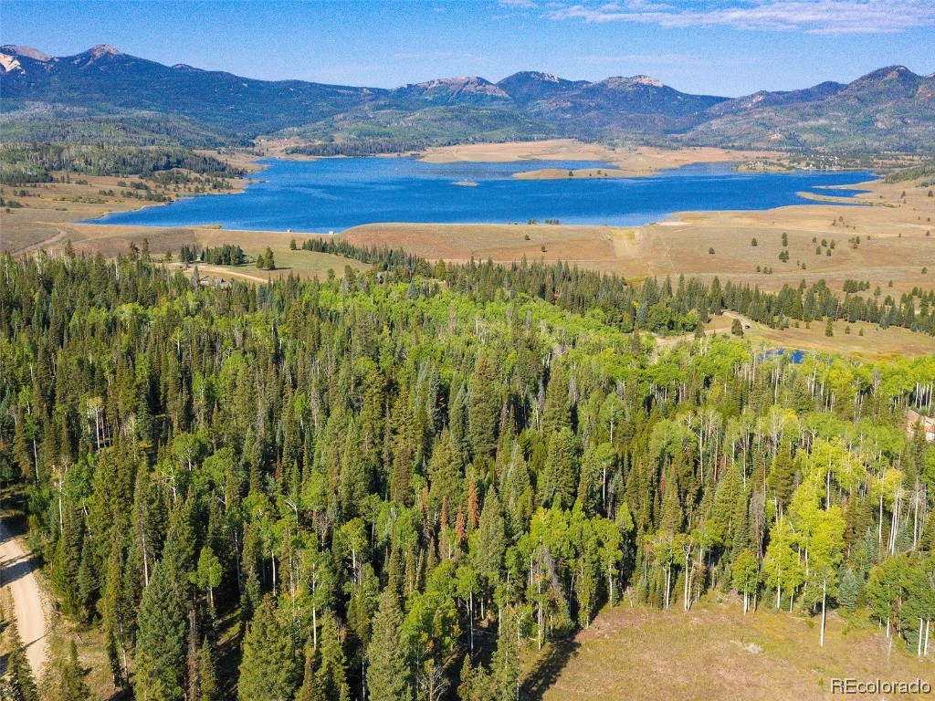 60218 Antelope Way Clark, CO 80428 - Photo 1 of 34 a view of a lake with mountains in the background