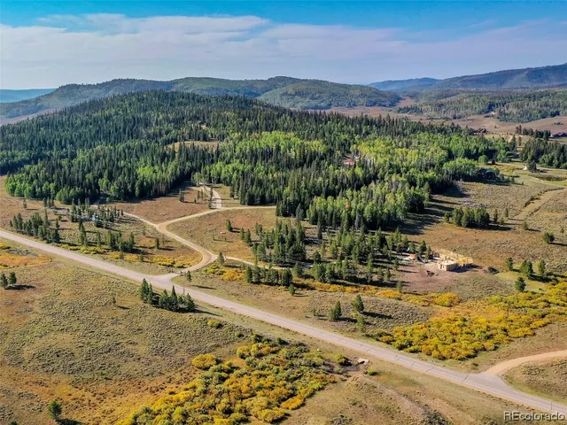 a view of a town with mountains in the background