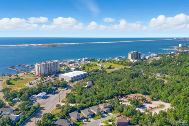 a view of empty room with wooden floor and fireplace