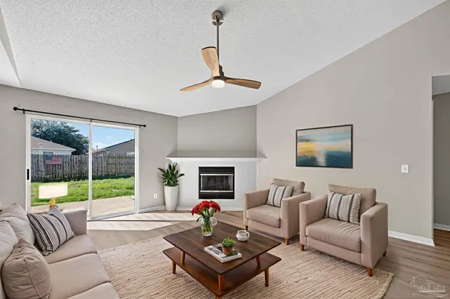 a bedroom with a bed and a flat tv screen on wall