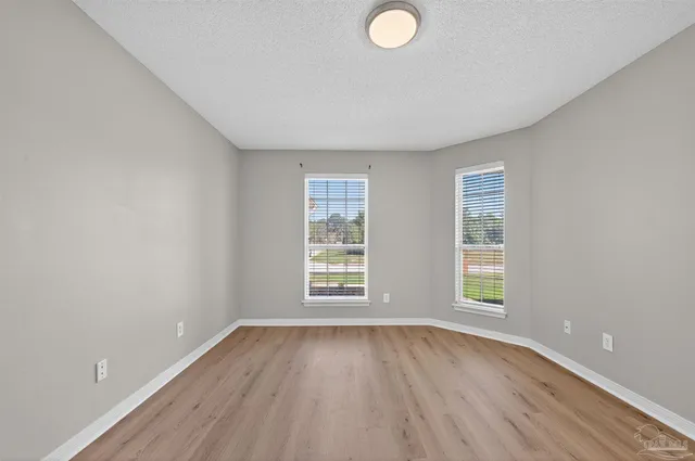 a bedroom with bed and a potted plant