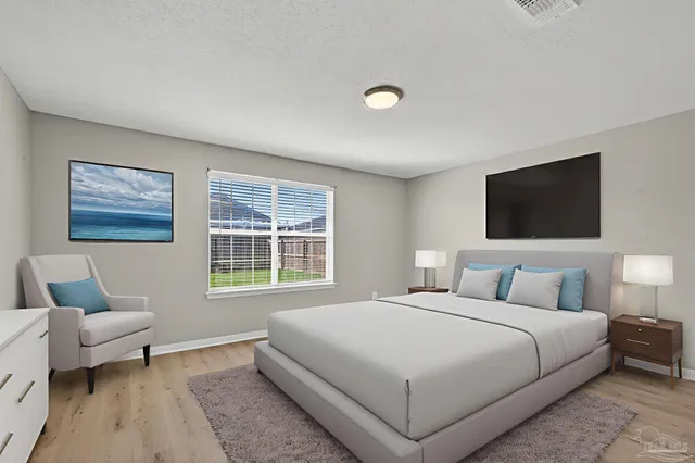 a view of a livingroom with wooden floor and window