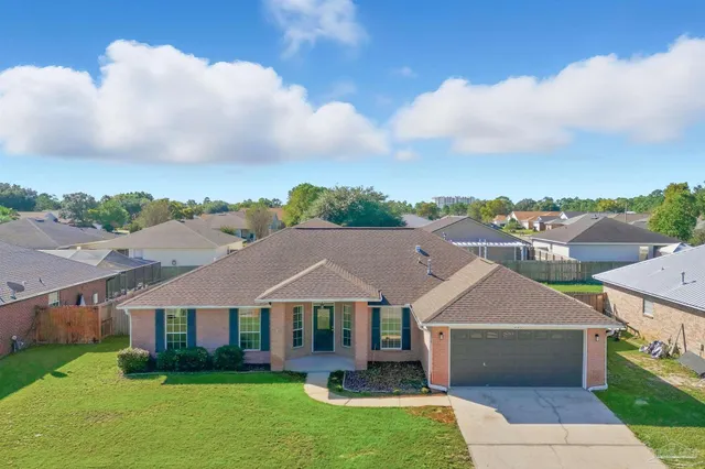 an aerial view of a city with lots of residential buildings in the back