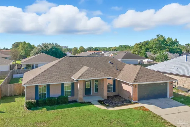 an aerial view of a houses with outdoor space