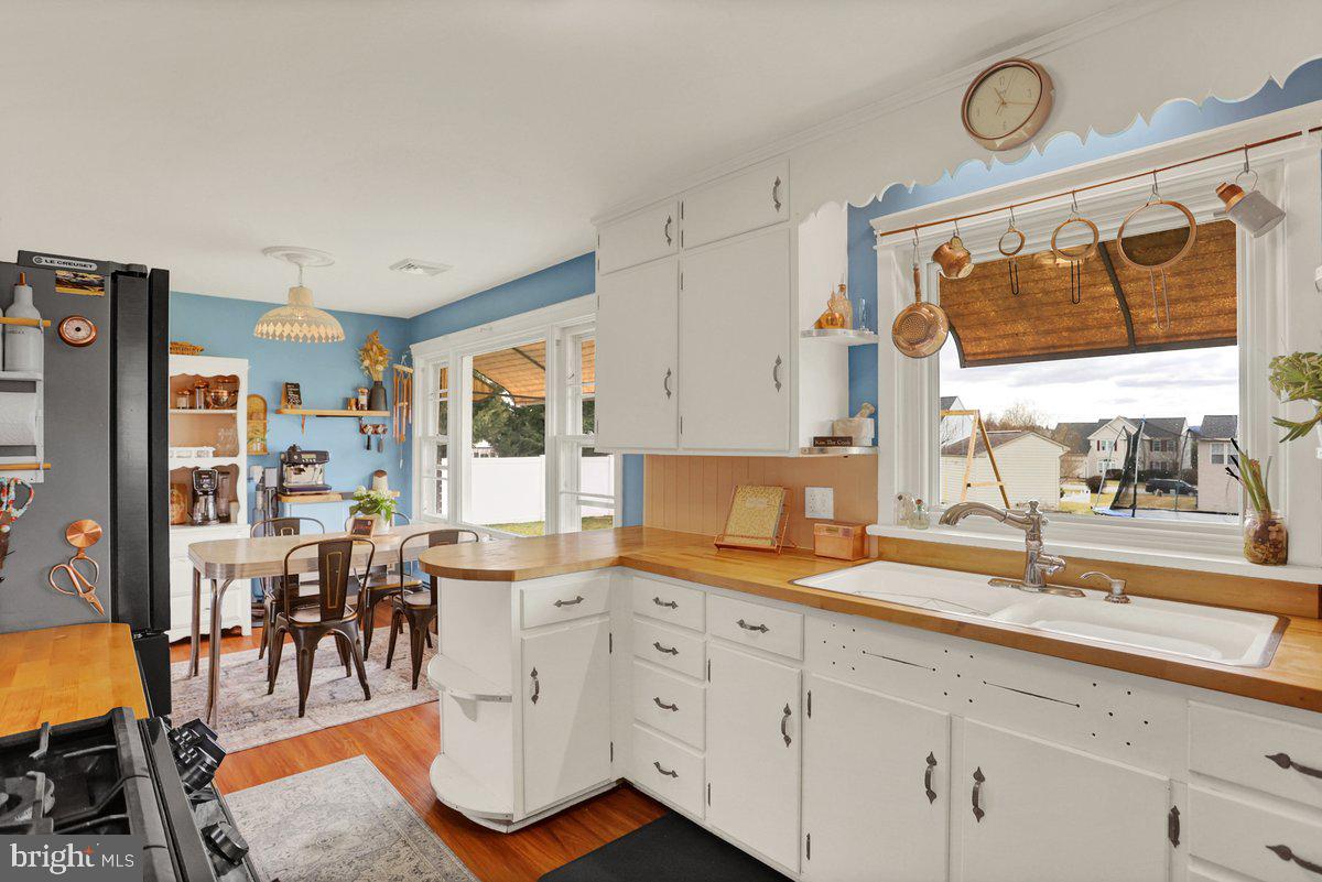172 Fairview Drive Hanover, PA 17331 - Photo 18 of 50 a very nice looking open kitchen with granite countertop a stove a sink a dining table and chairs