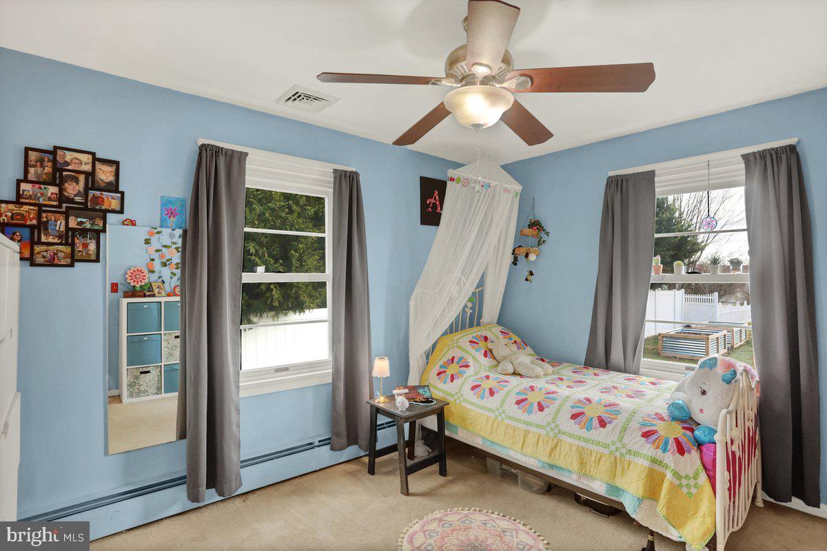 172 Fairview Drive Hanover, PA 17331 - Photo 26 of 50 a bedroom with a bed and a chandelier