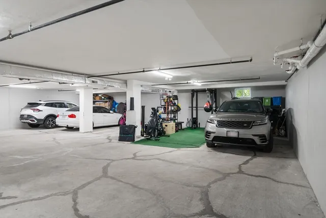 a car parked in front of a white building