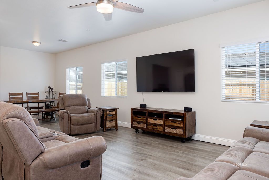 1014 Ocean Avenue Ridgecrest, CA 93555 - Photo 10 of 37 a living room with furniture and a flat screen tv