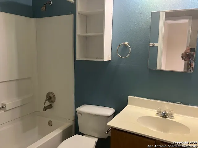 a bathroom with a sink a toilet and a bathtub