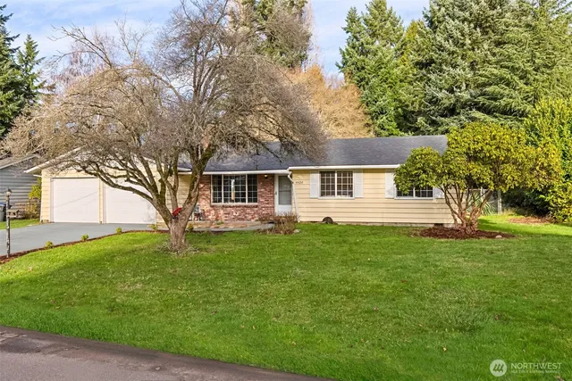 a house view with swimming pool in front of it
