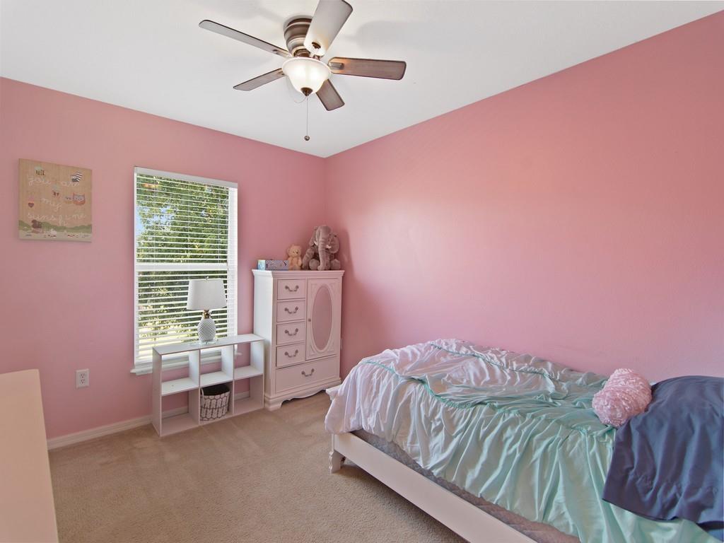 5985 Ridge Lake Circle Vero Beach, FL 32967 - Photo 11 of 27 a bedroom with a bed and a window