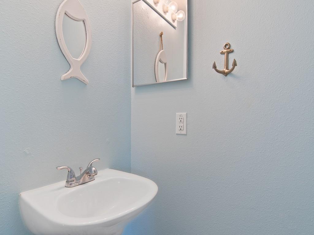5985 Ridge Lake Circle Vero Beach, FL 32967 - Photo 12 of 27 a bathroom with a sink and mirror