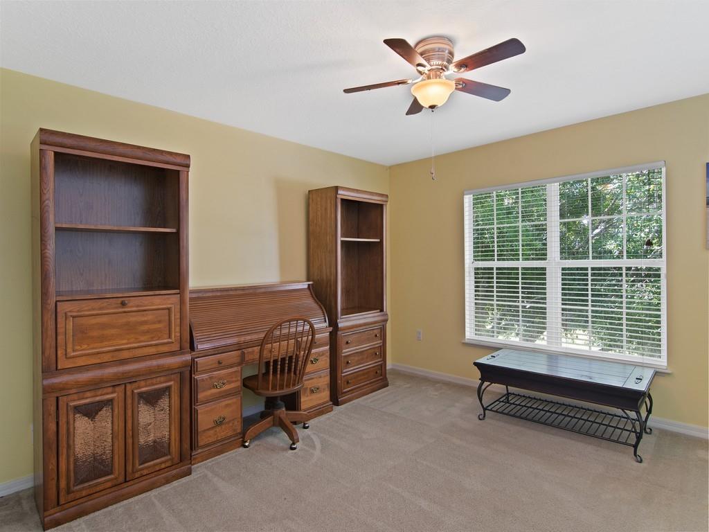 5985 Ridge Lake Circle Vero Beach, FL 32967 - Photo 9 of 27 a bedroom with furniture and a window