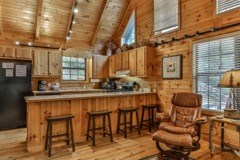 101 Moonshine Mountain Road Mineral Bluff, GA 30559 - Photo 12 of 70 a dining room with furniture and wooden floor