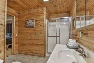 101 Moonshine Mountain Road Mineral Bluff, GA 30559 - Photo 20 of 70 a bathroom with a shower and a sink