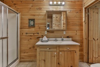 101 Moonshine Mountain Road Mineral Bluff, GA 30559 - Photo 23 of 70 a bathroom with a sink and a mirror