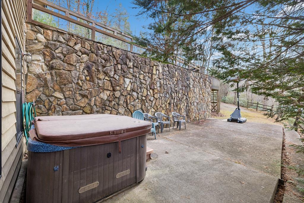 101 Moonshine Mountain Road Mineral Bluff, GA 30559 - Photo 34 of 70 a view of a patio with table and chairs