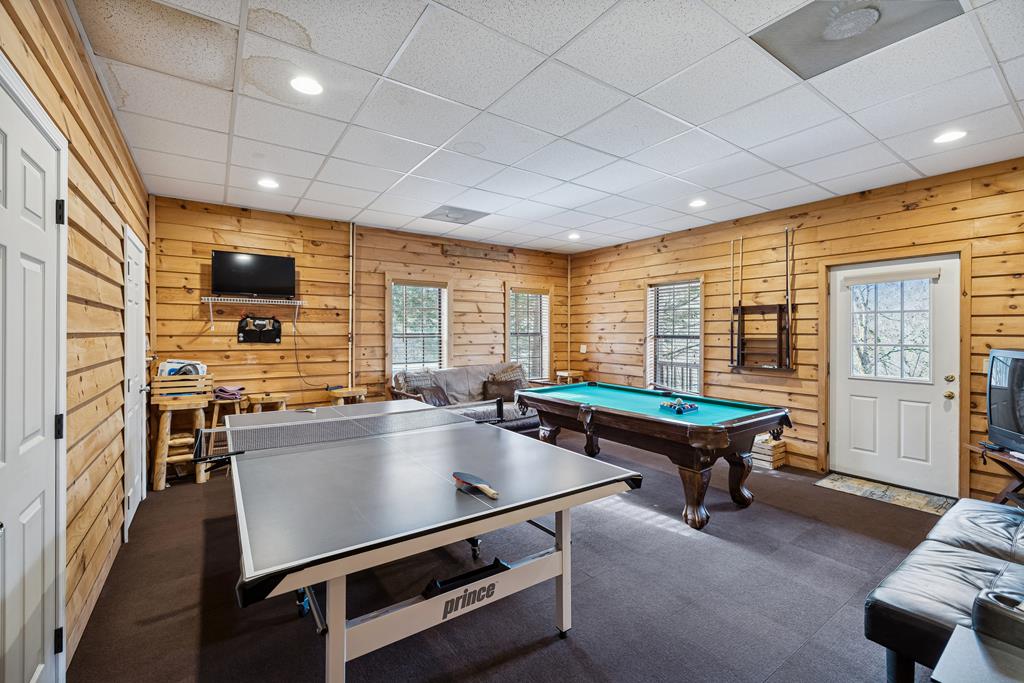 101 Moonshine Mountain Road Mineral Bluff, GA 30559 - Photo 38 of 70 a living room with furniture pool table and flat screen tv