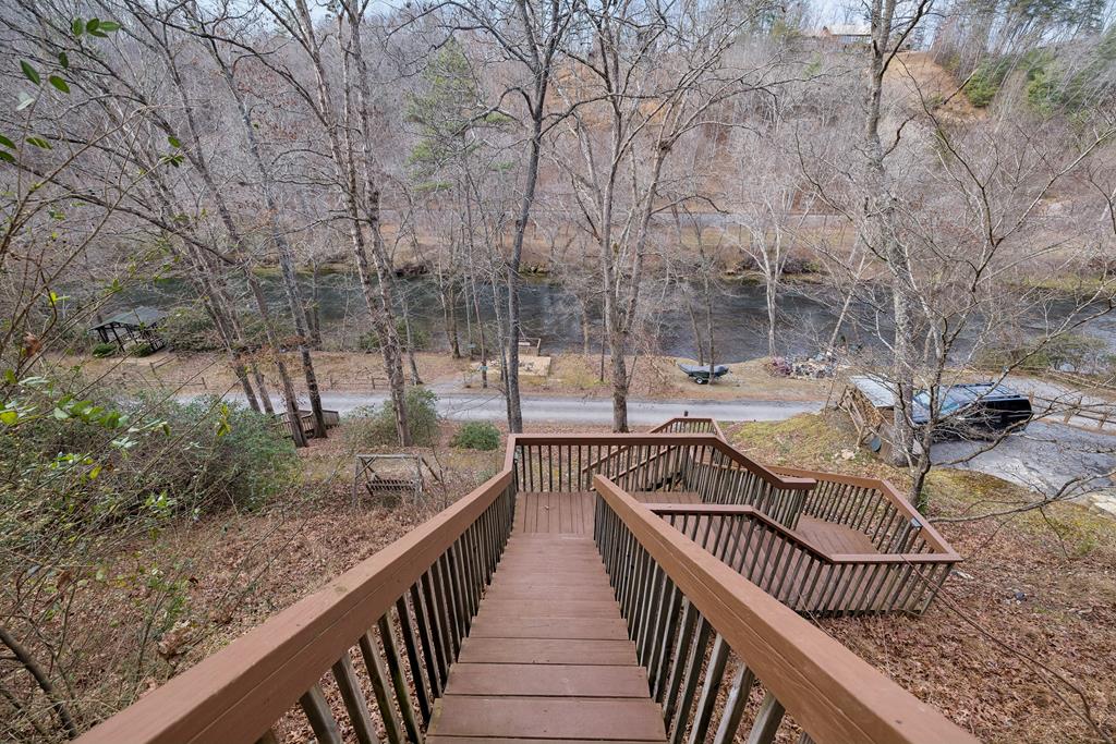101 Moonshine Mountain Road Mineral Bluff, GA 30559 - Photo 60 of 70 a view of a roof deck with table and chairs
