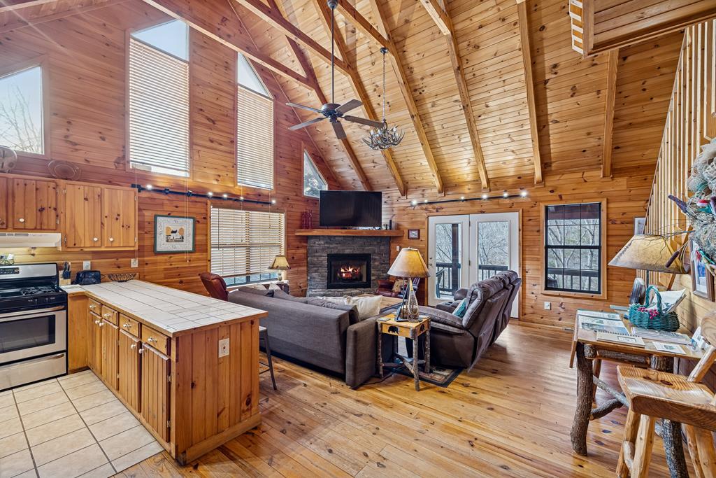 101 Moonshine Mountain Road Mineral Bluff, GA 30559 - Photo 61 of 70 a view of a patio with couches chairs and a fireplace