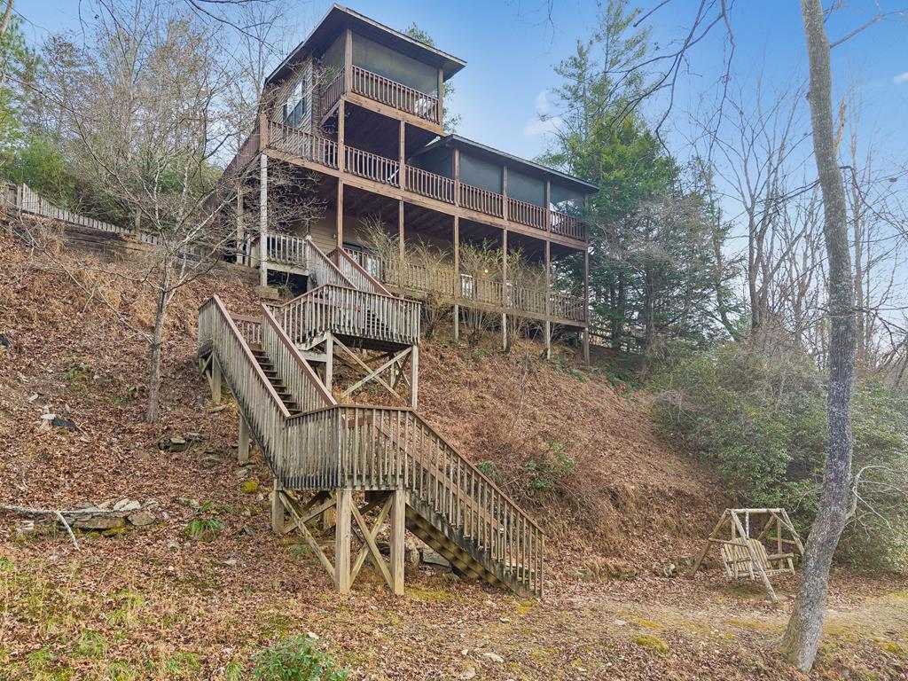 101 Moonshine Mountain Road Mineral Bluff, GA 30559 - Photo 67 of 70 a view of a chairs with table in front of the house