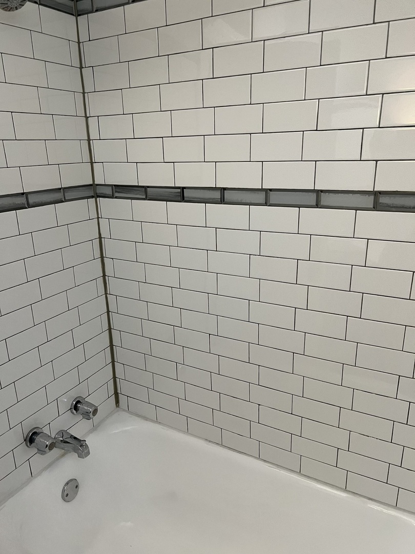 1243 West 96th Street Chicago, IL 60643 - Photo 7 of 13 a bathroom with a white bathtub and a shower