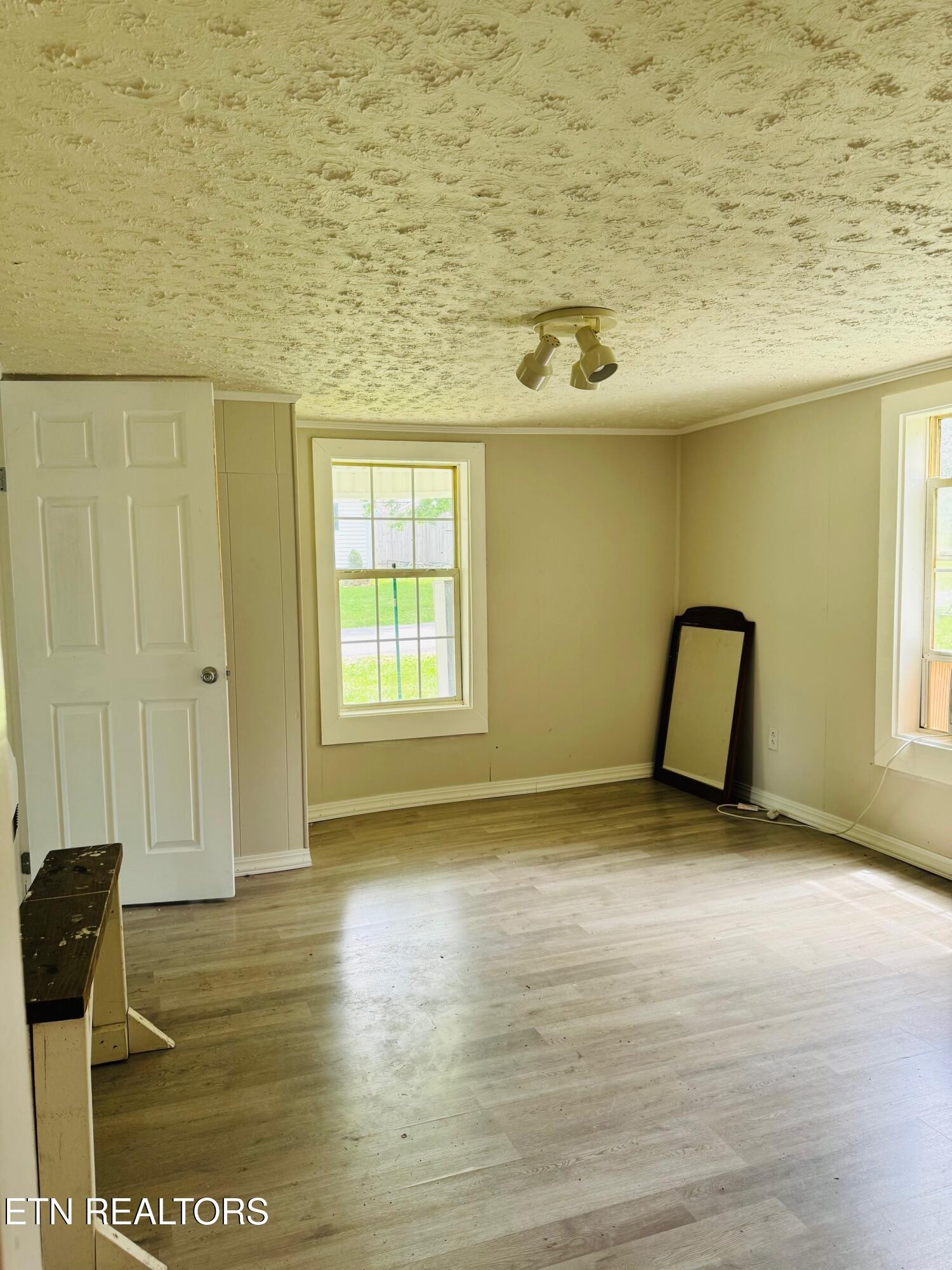 738 Warford Road Newport, TN 37821 - Photo 10 of 17 a view of a livingroom with wooden floor and a window