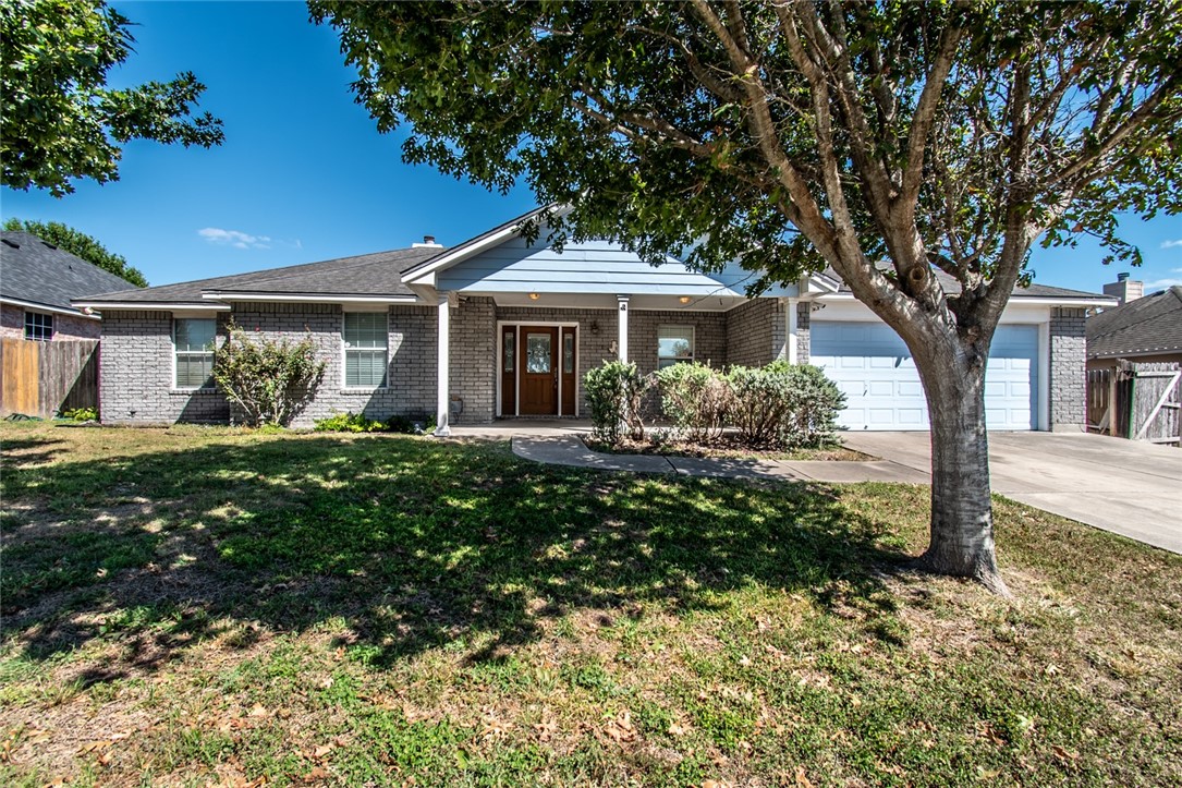 103 Collins Street Odem, TX 78370 - Photo 1 of 32 a front view of a house with garden