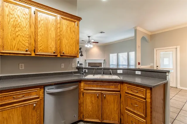 a kitchen with stainless steel appliances granite countertop a sink and cabinets