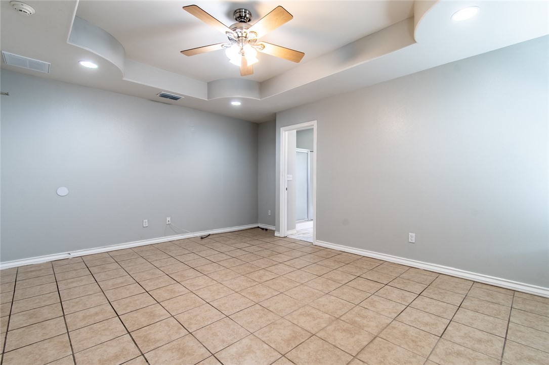 103 Collins Street Odem, TX 78370 - Photo 15 of 32 an empty room with fan