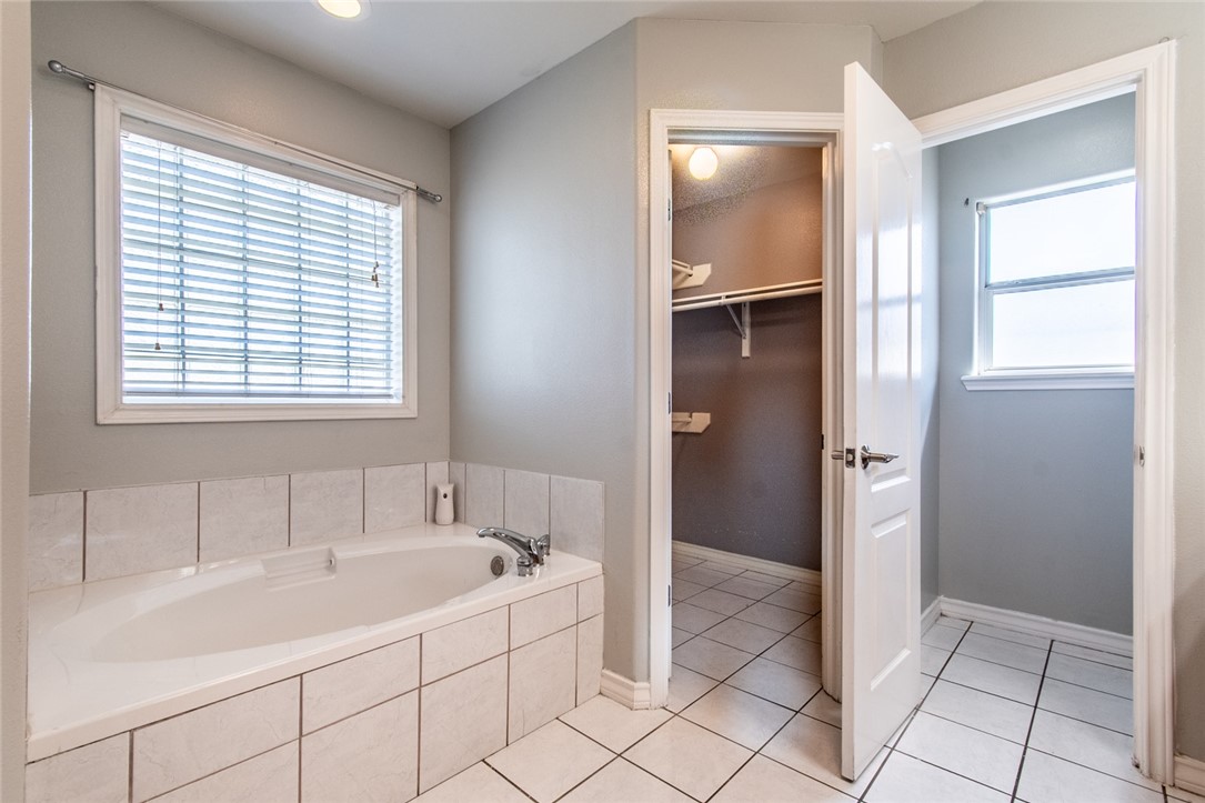 103 Collins Street Odem, TX 78370 - Photo 18 of 32 a bathroom with a sink and a bathtub