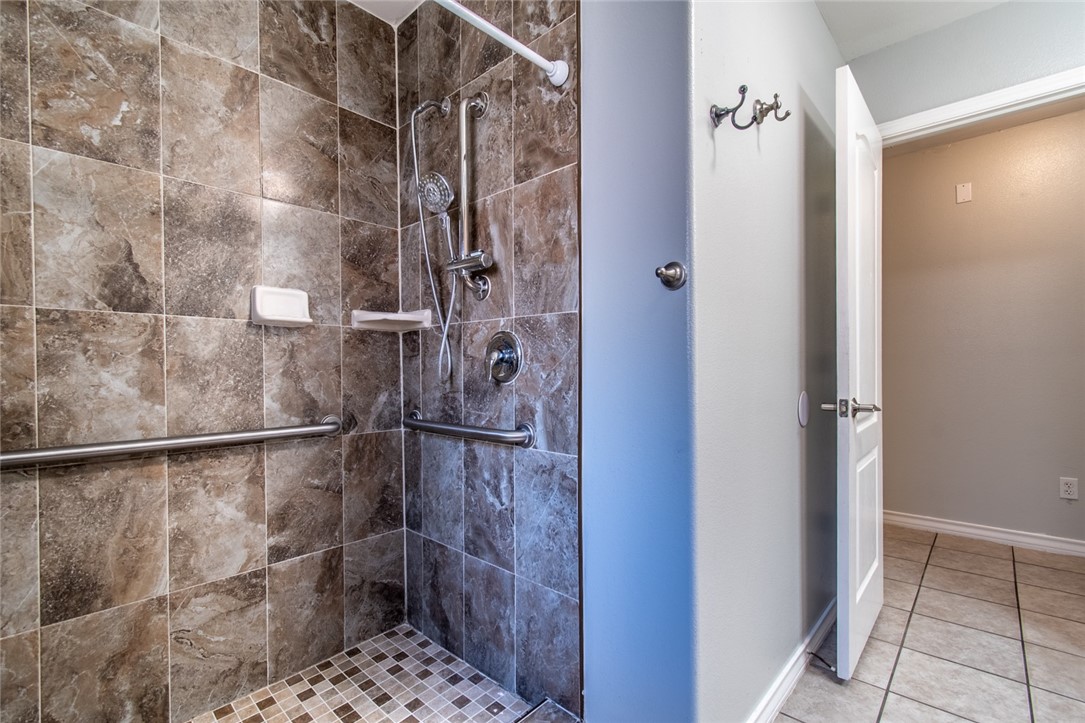 103 Collins Street Odem, TX 78370 - Photo 27 of 32 a bathroom with a shower