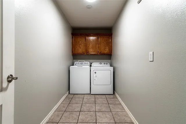 a view of a house with a backyard and a tub