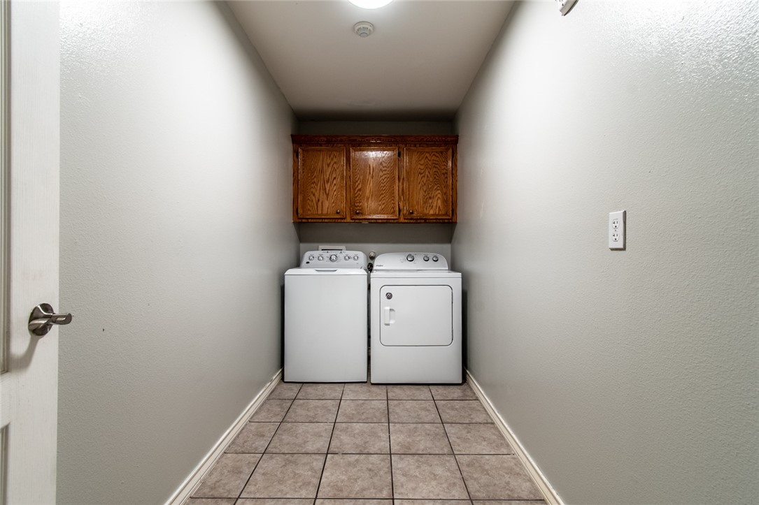 103 Collins Street Odem, TX 78370 - Photo 28 of 32 a utility room with dryer and washer