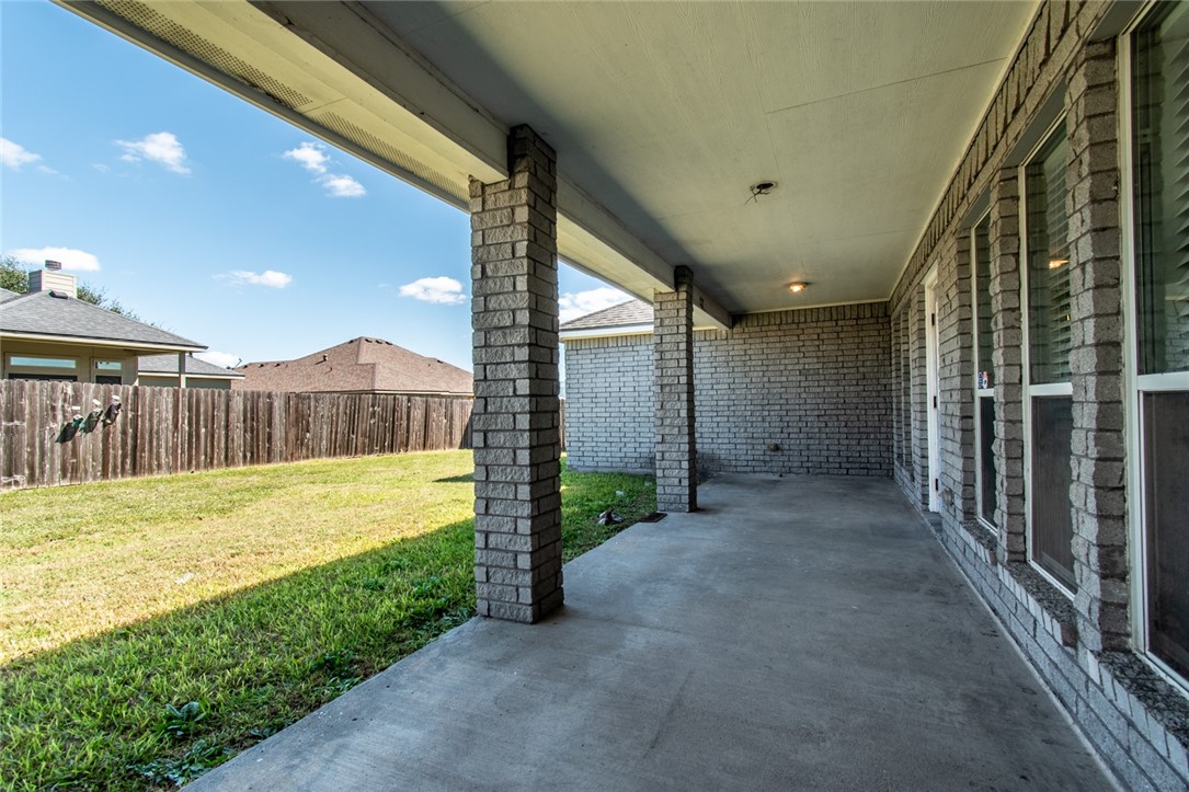103 Collins Street Odem, TX 78370 - Photo 29 of 32 a view of a house with a backyard and a tub