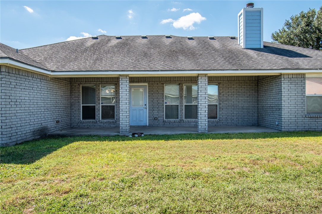 103 Collins Street Odem, TX 78370 - Photo 30 of 32 a view of a house with swimming pool and porch