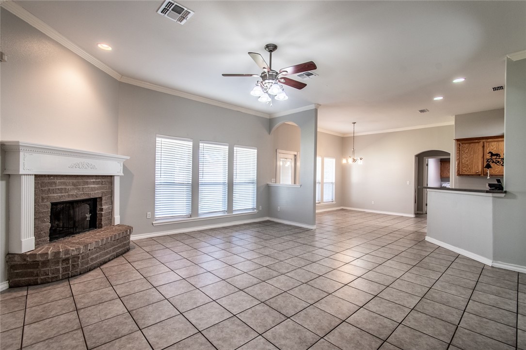 103 Collins Street Odem, TX 78370 - Photo 5 of 32 a view of an empty room with window and fireplace