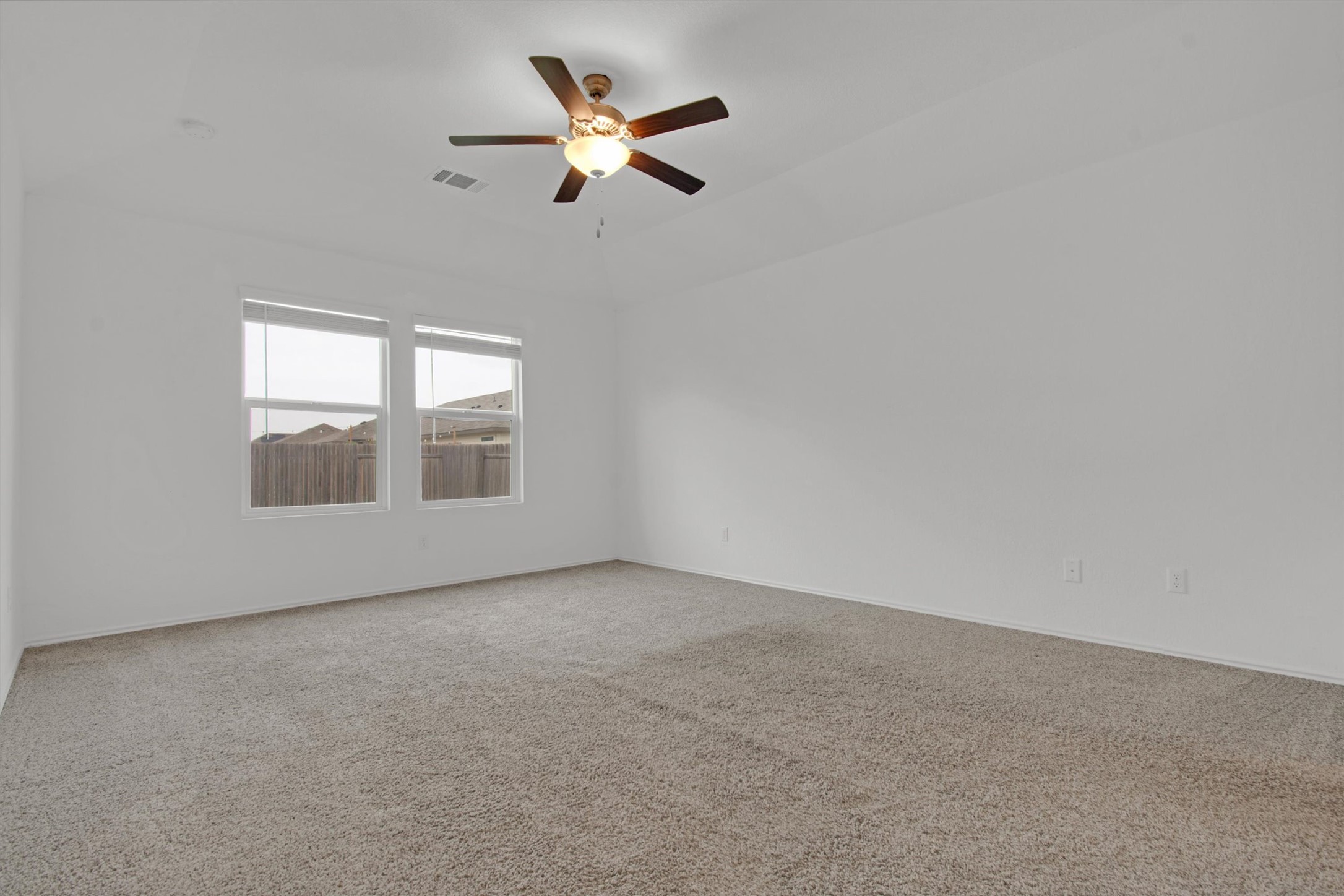 703 Bluejack Way Hutto, TX 78634 - Photo 11 of 19 Empty room with carpet flooring and ceiling fan