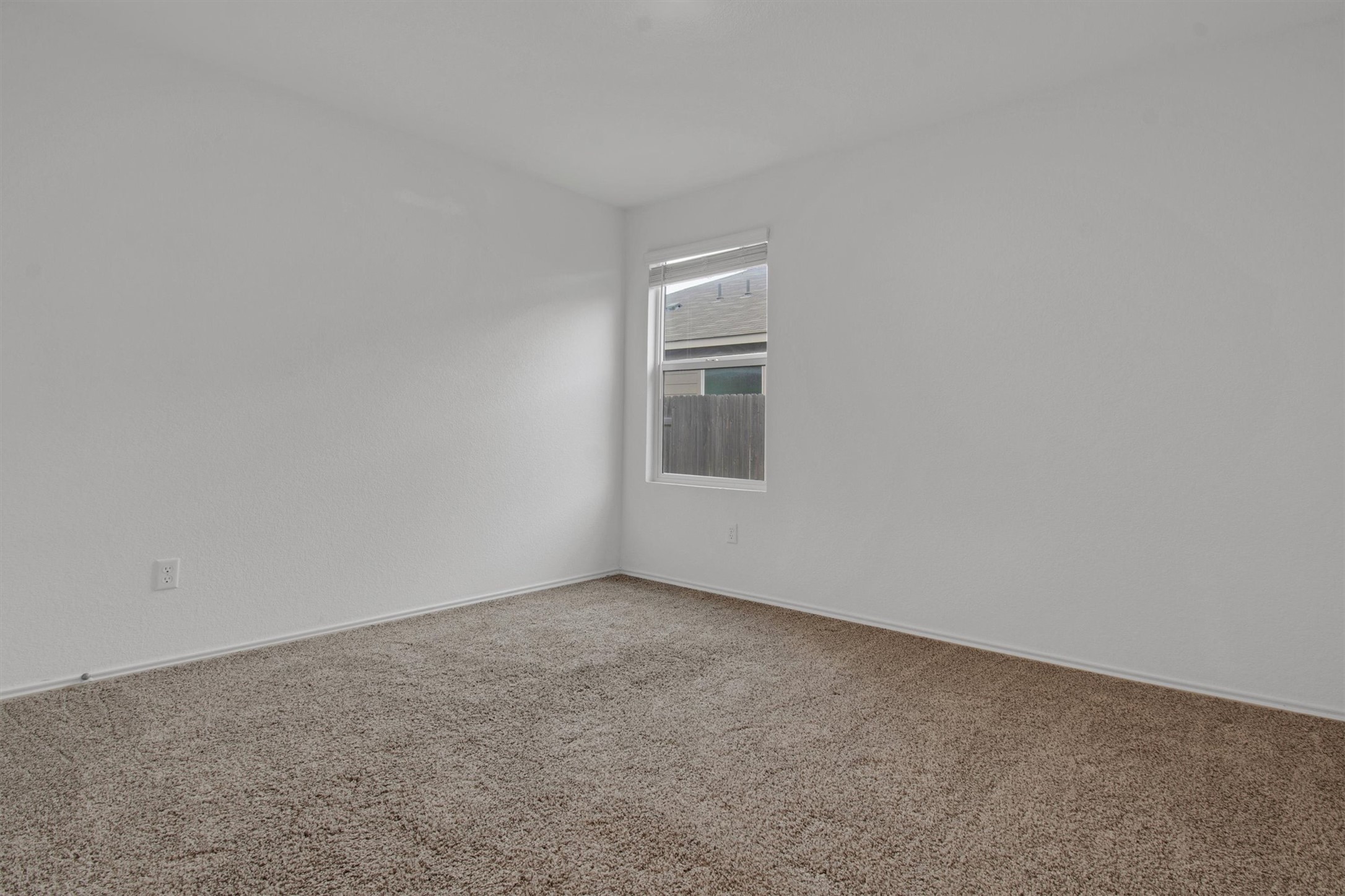 703 Bluejack Way Hutto, TX 78634 - Photo 14 of 19 Unfurnished room featuring carpet floors