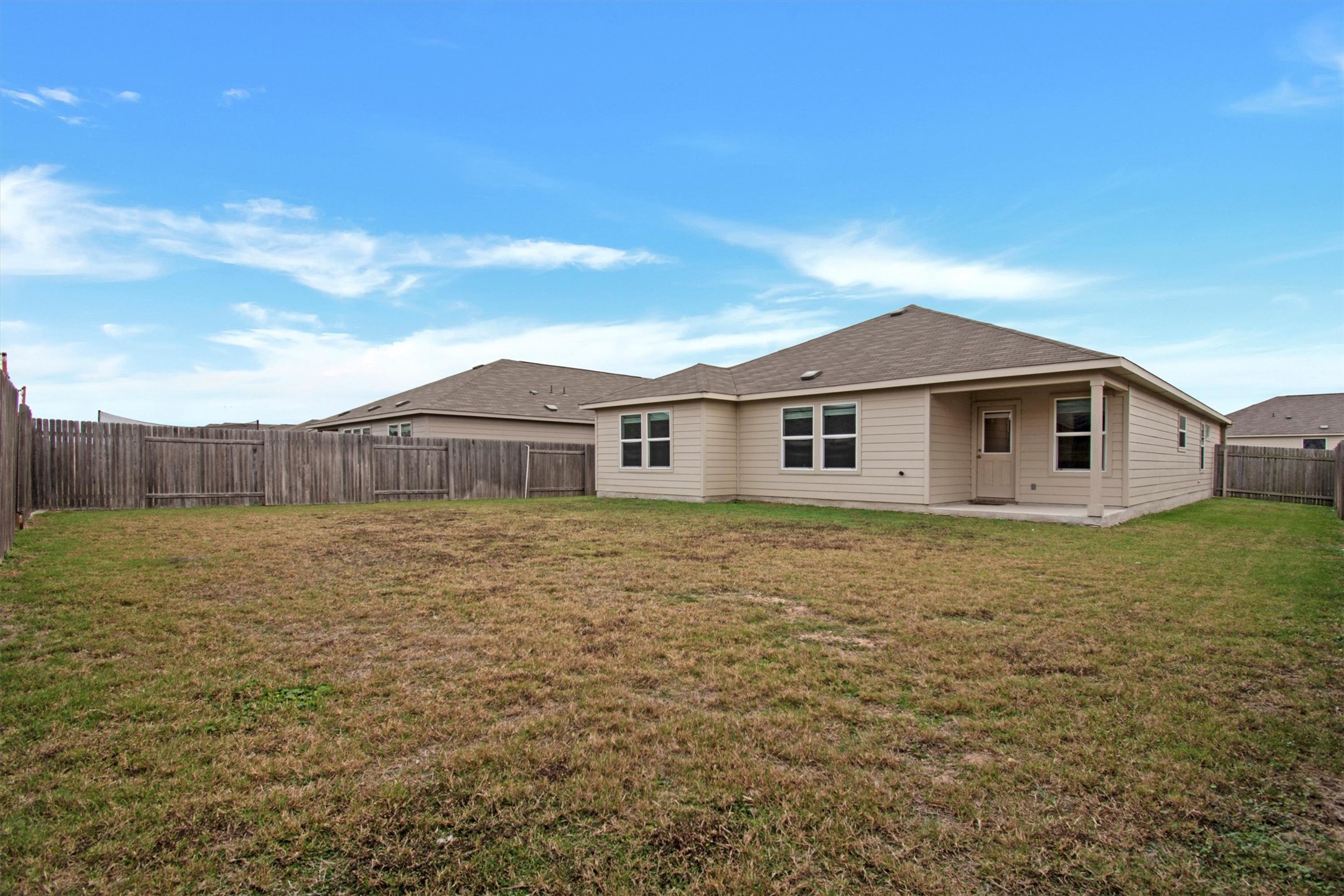 703 Bluejack Way Hutto, TX 78634 - Photo 19 of 19 Rear view of property with a patio area and a fenced backyard