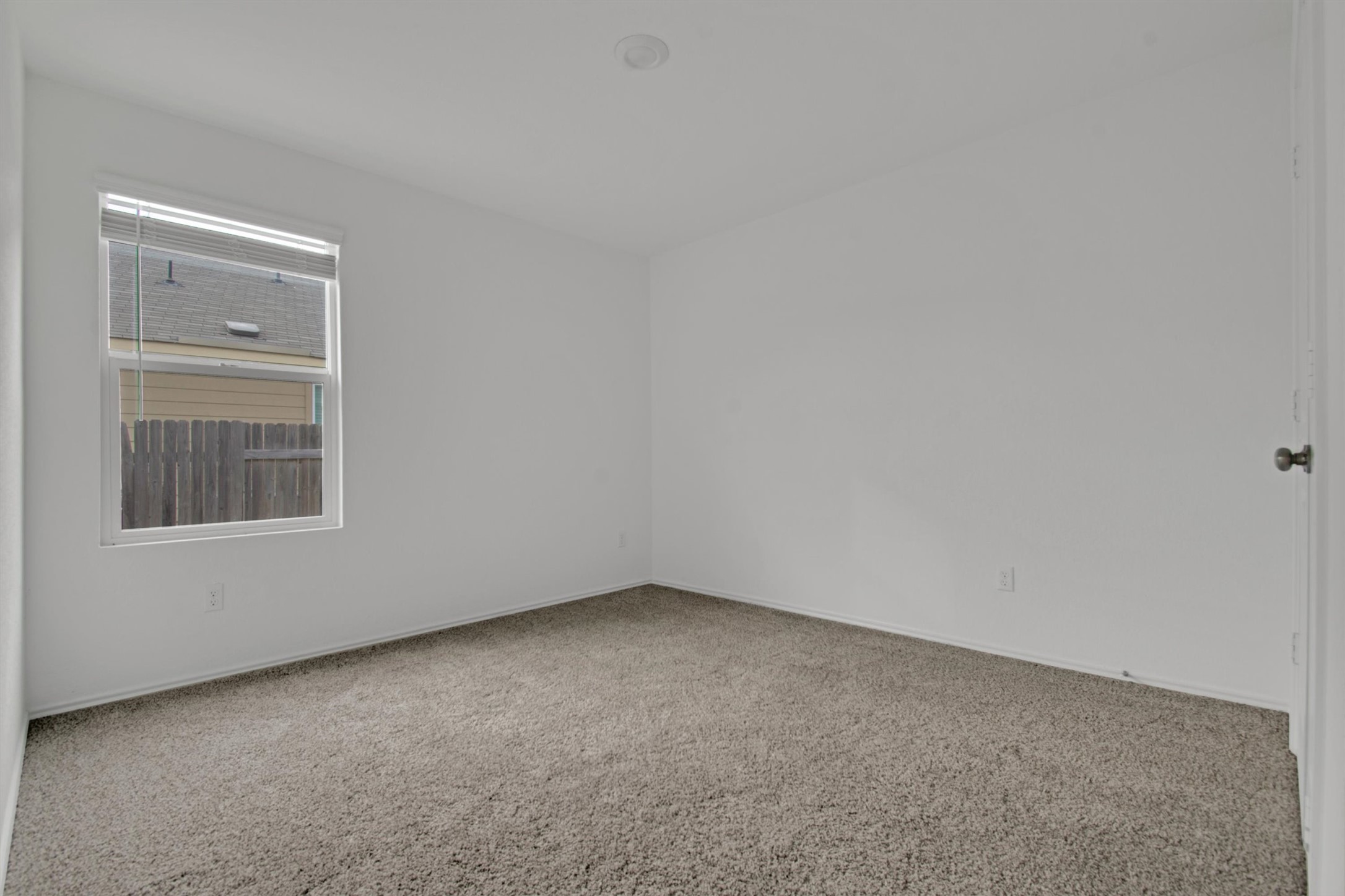 703 Bluejack Way Hutto, TX 78634 - Photo 5 of 19 Unfurnished room featuring carpet and baseboards