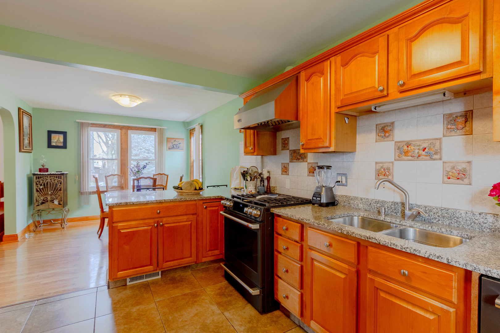 6410 Sinclair Avenue Berwyn, IL 60402 - Photo 11 of 31 a kitchen with stainless steel appliances granite countertop a sink stove and cabinets