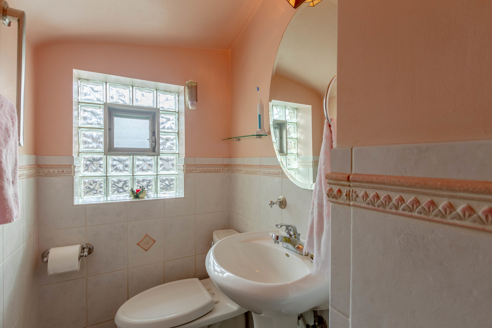 6410 Sinclair Avenue Berwyn, IL 60402 - Photo 16 of 31 a bathroom with a toilet sink and mirror